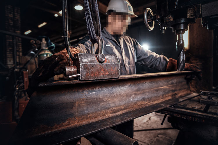 man-helmet-is-moving-piece-rail-metal-factory